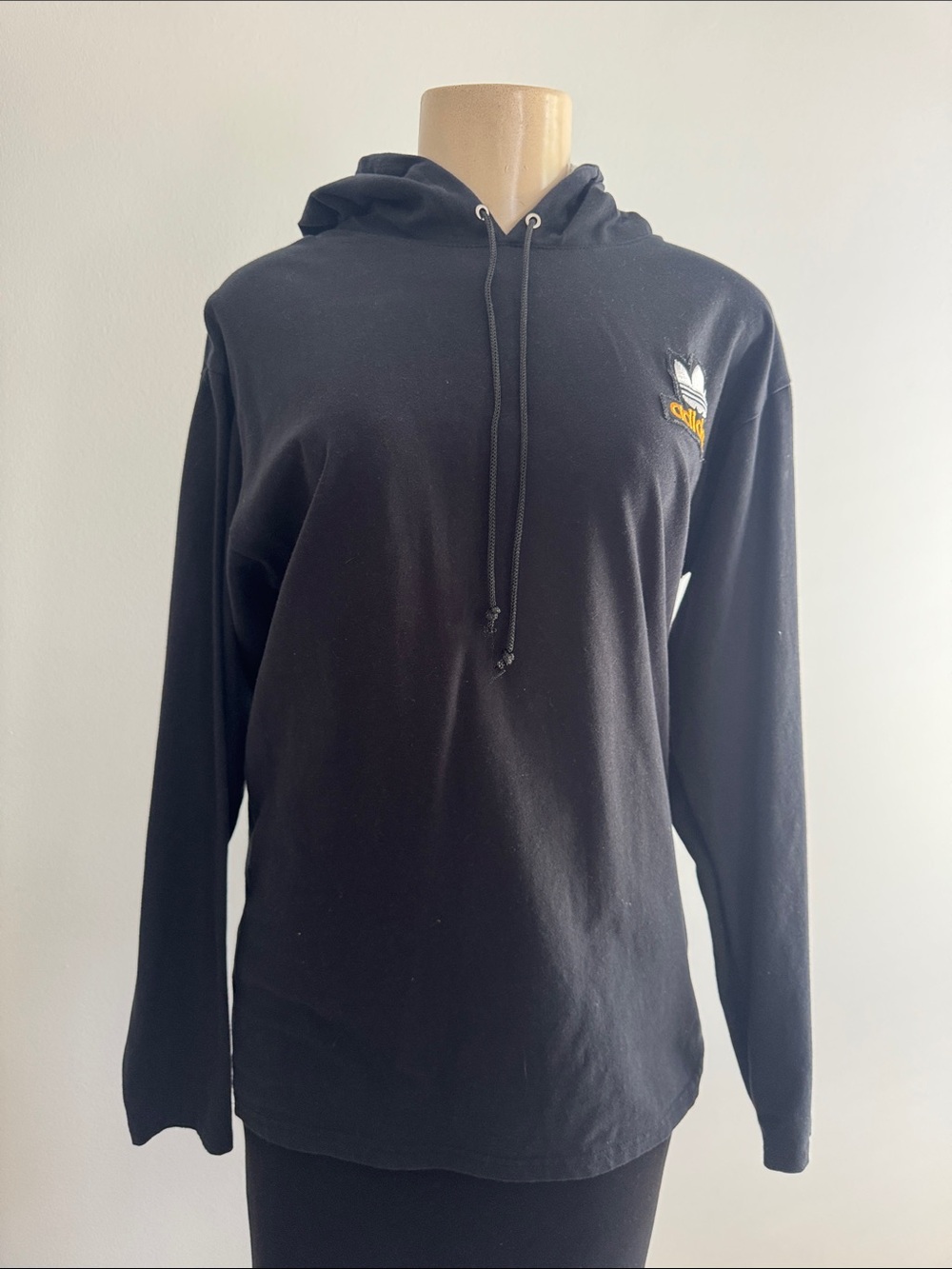 Black Hoodie with White Trefoil and Gold Logo Stitching